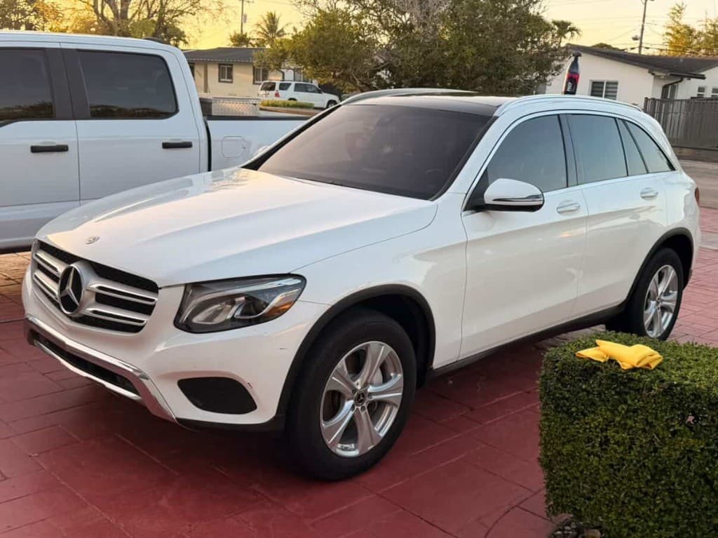 White Mercedes-Benz SUV on driveway after exterior detail